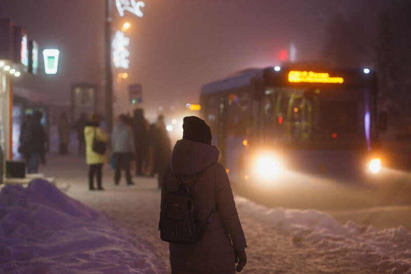 waiting for a bus in snow