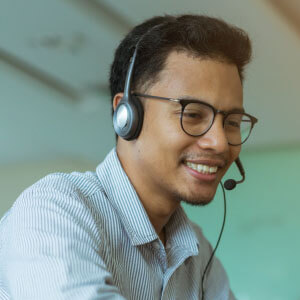 Man working at a call center representing the clerical industry.
