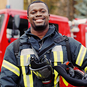 A fireman posing representing the public service industry.