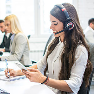 A woman with a phone headset representing the sales industry.