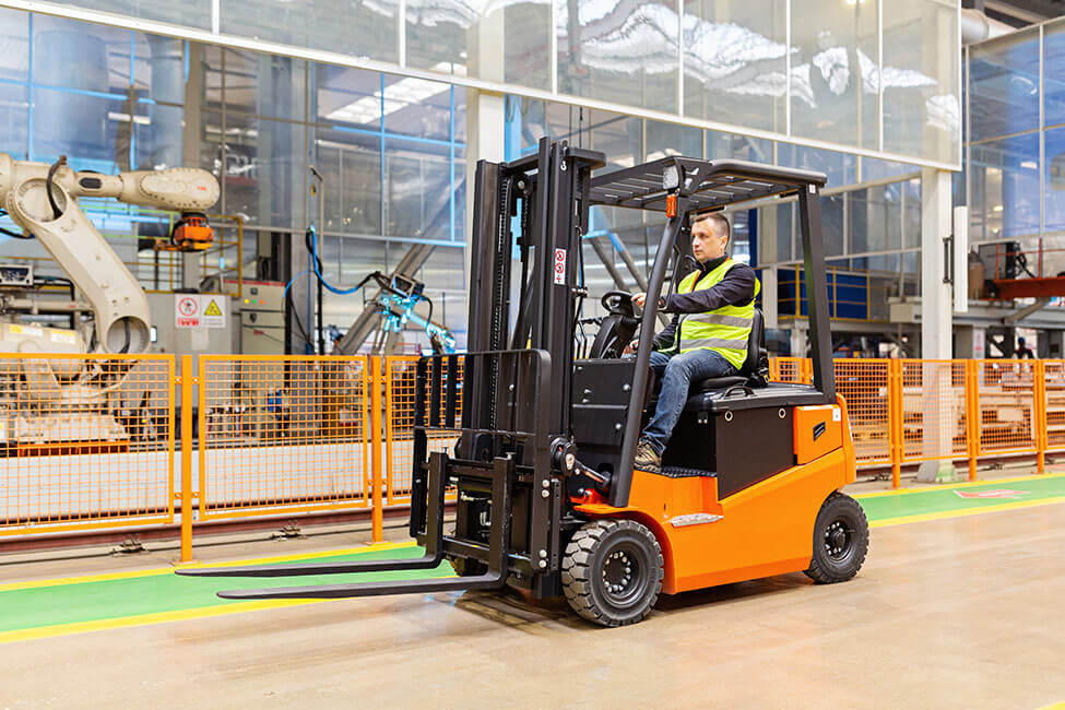 Forklift operator in a manufacturing plant
