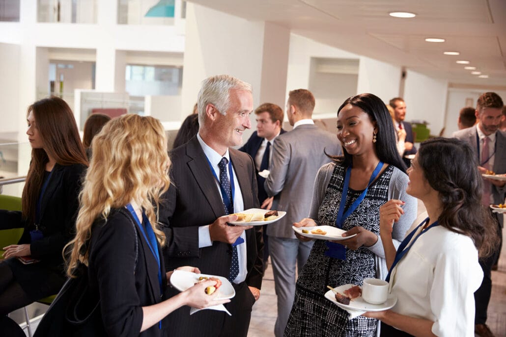 Conference attendees participating in active listening during a conversation