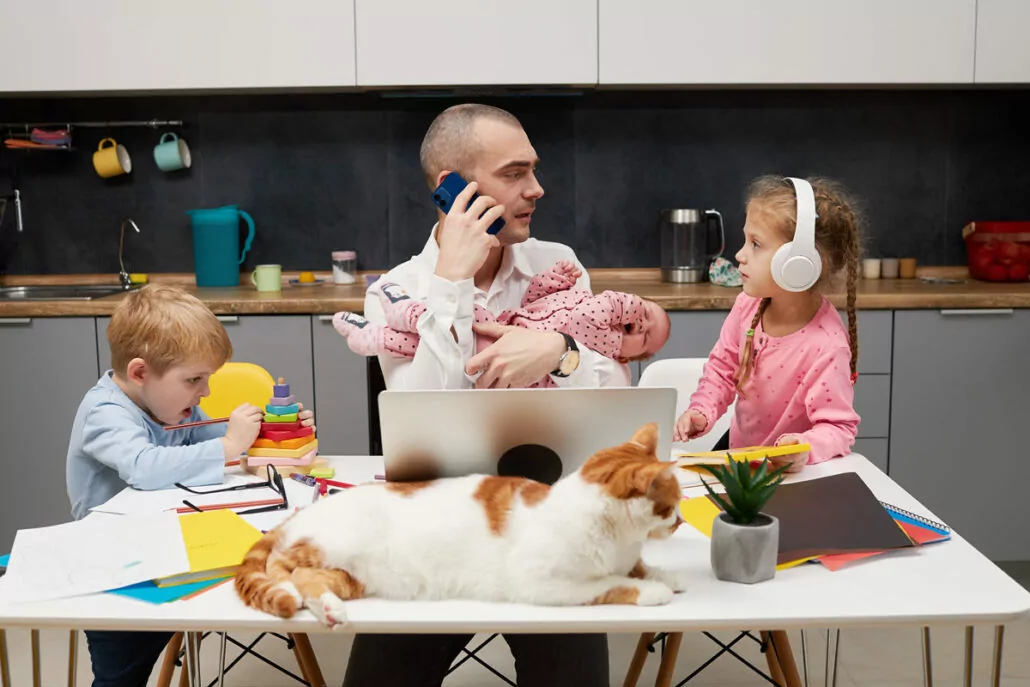 A parent working from home while spending time with their child