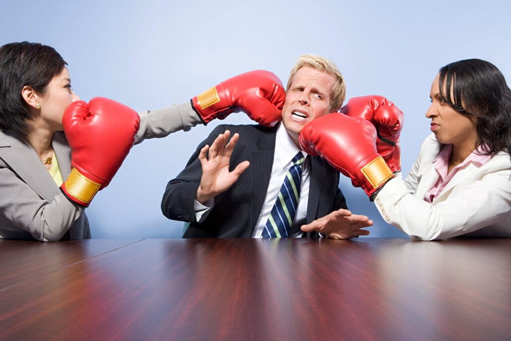 Workers boxing each other representing non professional ways to deal with bad coworkers