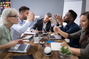 A table of employees on the job who are arguing due to a difficult coworker