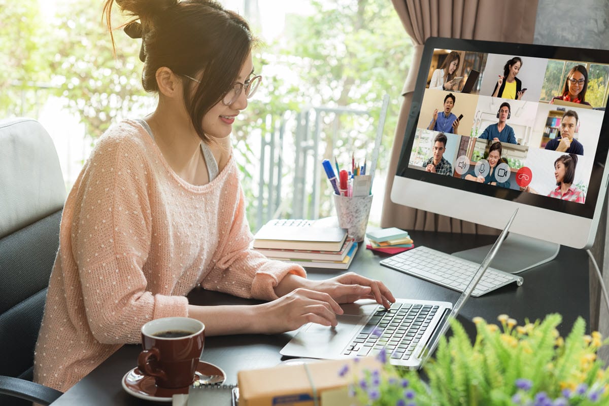 A woman enjoying working at home, representing the top types of remote jobs in 2024.