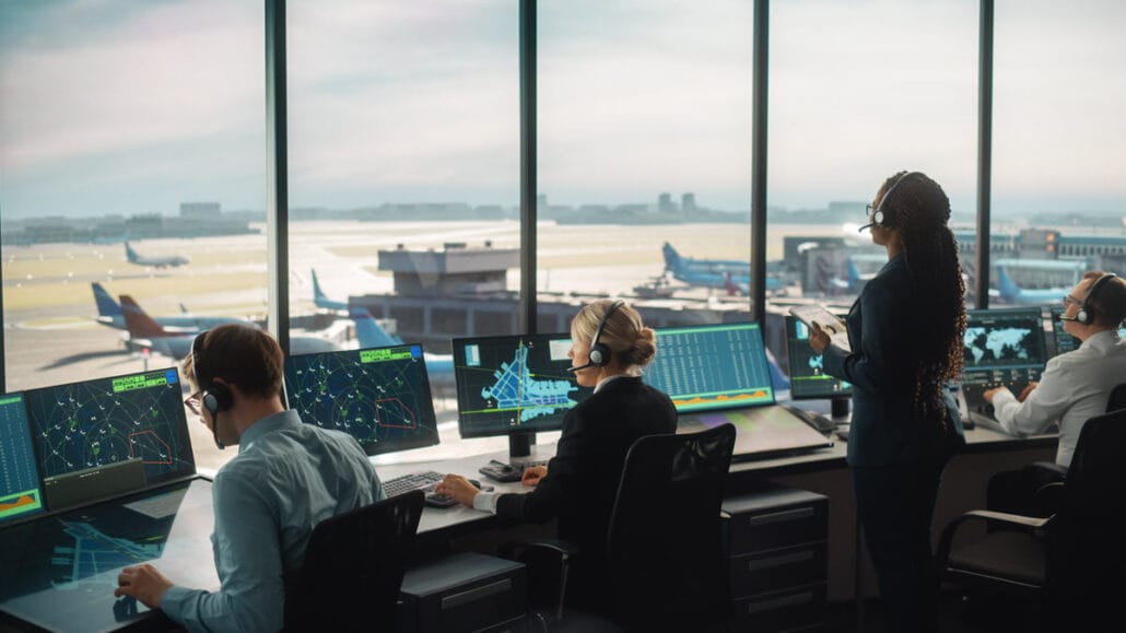 Air traffic controllers in a tower at an airport, some of the alternative career paths for associate degree holders.