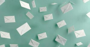 Envelopes against a solid background the represent how to reply to an email.