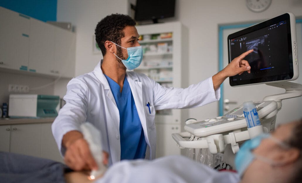 A diagnostic medical sonographer performing an ultrasound