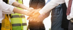 Trade union members and representatives putting their hands together