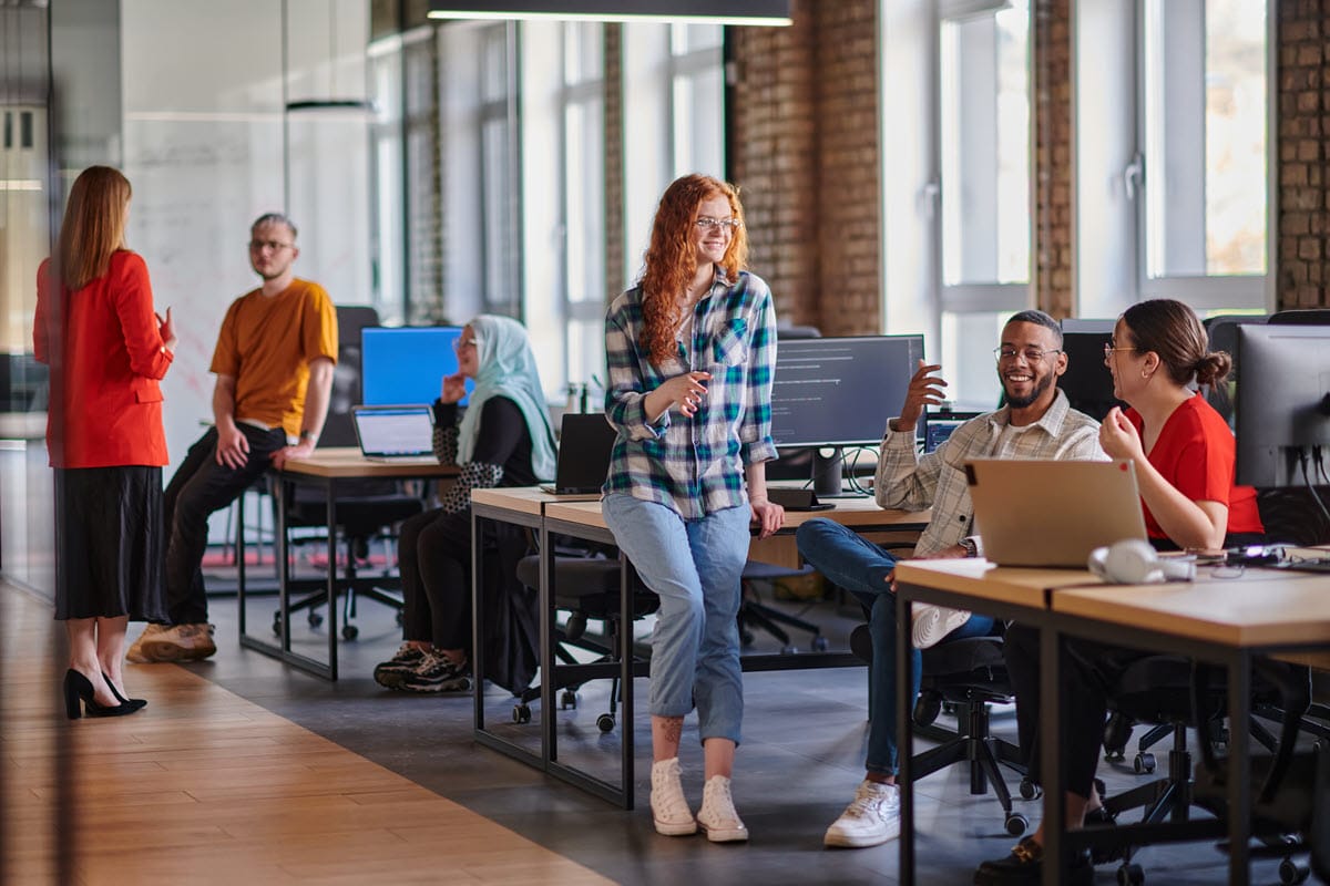 Workers from different companies working in a shared physical space in industrial office buildings