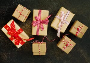 A variety of wrapped employee holiday gifts.